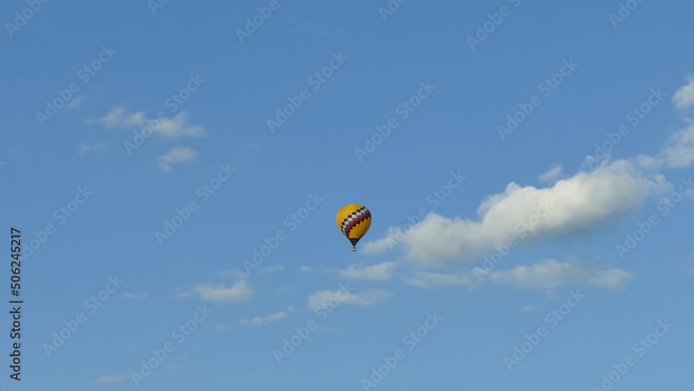 Hot air balloon floats in the sky