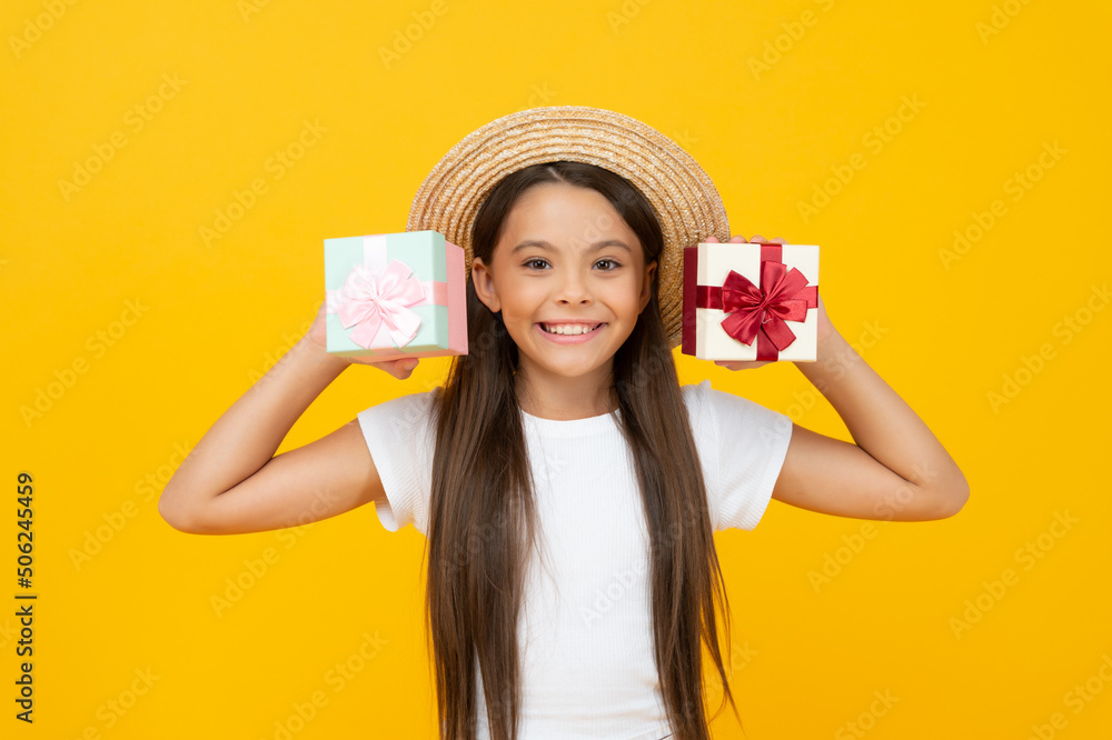 happy teen girl hold present box on yellow background happy teen girl hold present box on yellow background