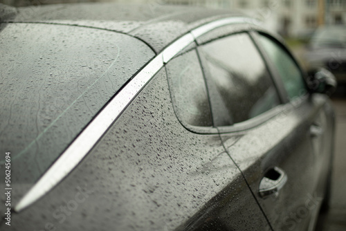 Obraz na plátně Black premium car. Transport in raindrops.