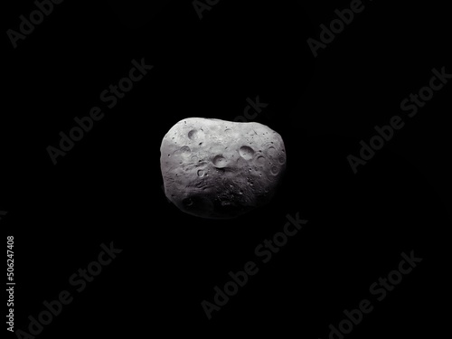 Asteroid covered with craters. Space rock on a black background. Large meteorite isolated.