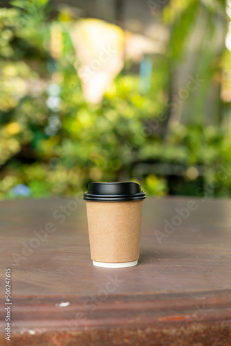 hot coffee cup on wood table