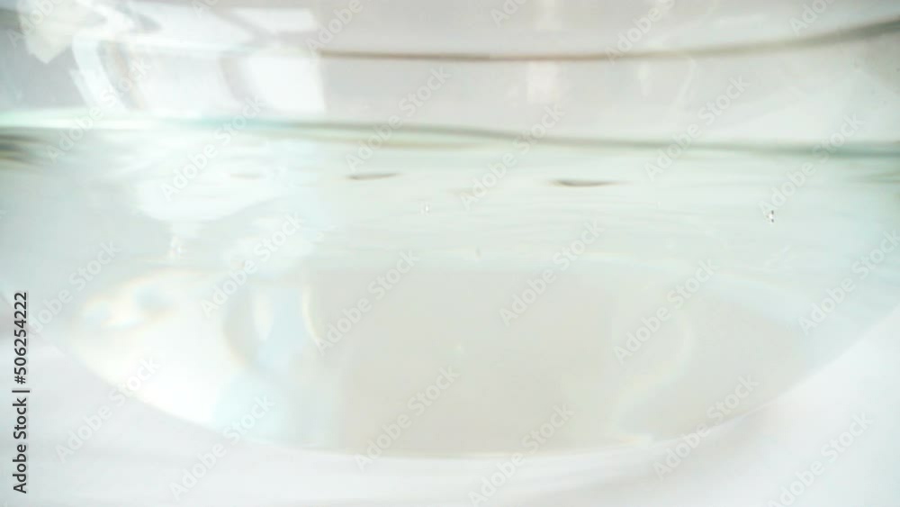Falling apples in a glass bowl of water. Slow motion. Falling apples in a glass bowl of water. Slow motion.