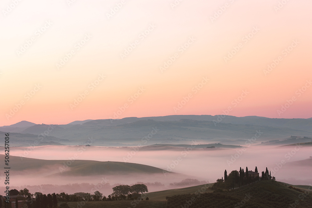 Sunrise with fog over a valley in Tuscany - Italy II