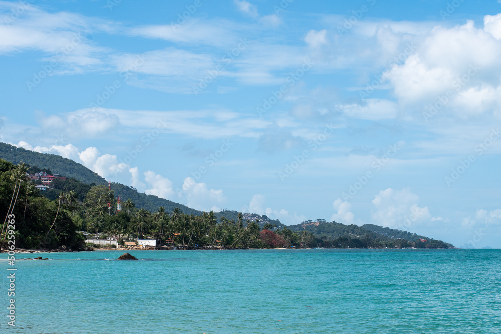 Tropical beach. Beautiful sandy beach with palm trees. Summer holidays and tourism Tropical beach. Beautiful sandy beach with palm trees. Summer holidays and tourism