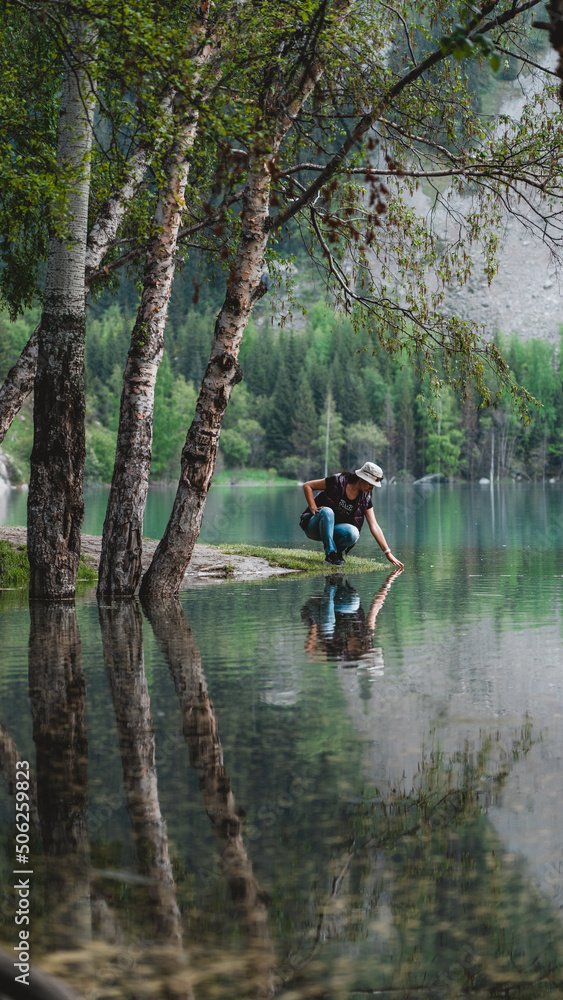 Woman on lake in mountains