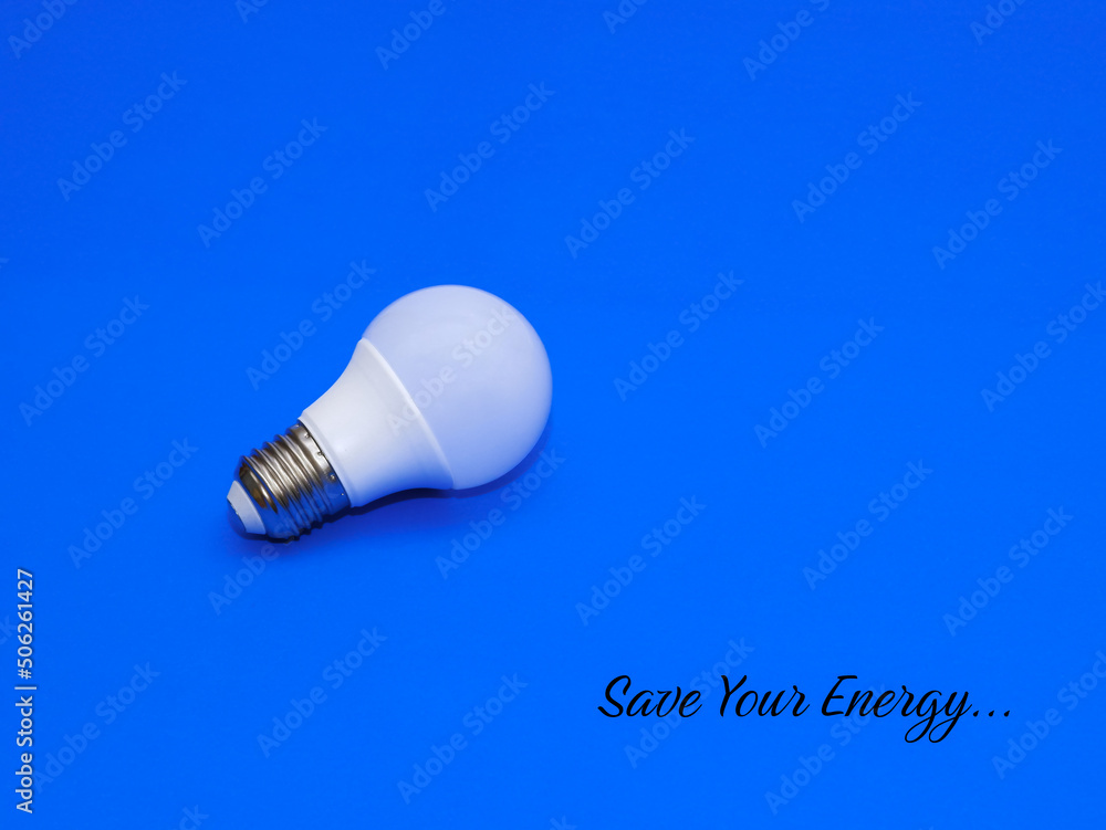 Save Your Energy. Light bulb isolated with blue background. Save Your Energy. Light bulb isolated with blue background.
