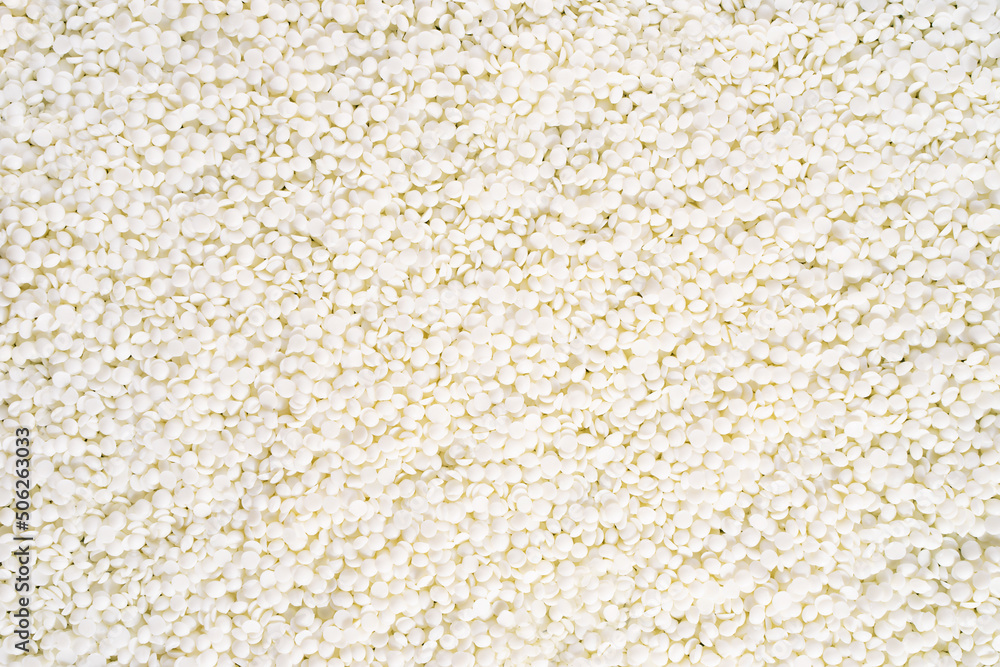 Full frame of soy wax flakes for candle making. Organic soy wax background for design, text. Top view. copy space. Flat lay. Full frame of soy wax flakes for candle making. Organic soy wax background for design, text. Top view. copy space. Flat lay.