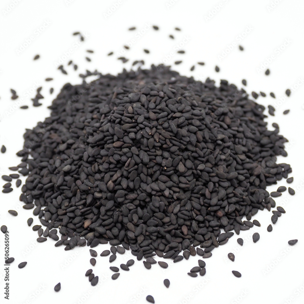 Black sesame seed isolated on white background. spot focus. Black sesame seed isolated on white background. spot focus.