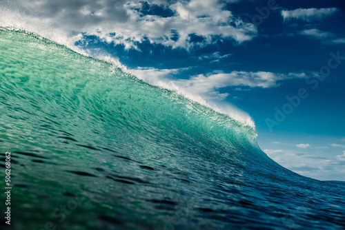 Fototapeta Naklejka Na Ścianę i Meble -  Turquoise wave with sunlight breaking in ocean