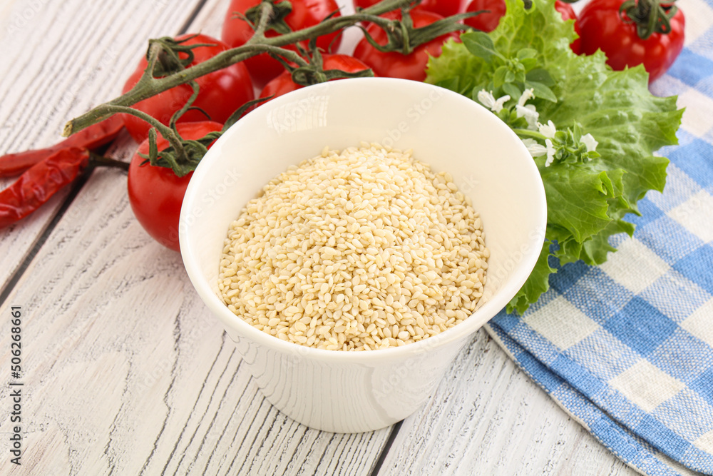 Raw sesame seeds in the bowl Raw sesame seeds in the bowl