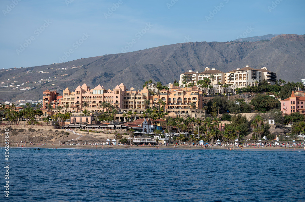 View on resorts and beaches of South coast of Tenerife island during sail boat trip along coastline, Canary islands, Spain