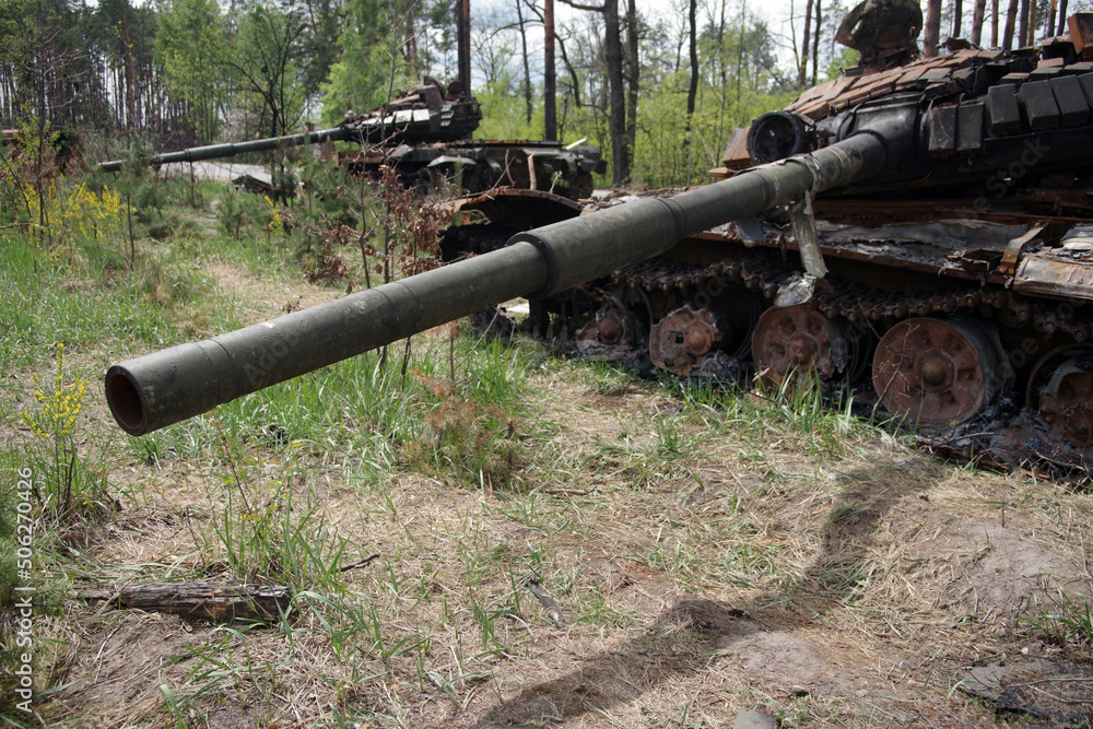 Russian tank was destroyed by the Ukrainian army in the Kyiv region. Selective focus. Russian tank was destroyed by the Ukrainian army in the Kyiv region. Selective focus.