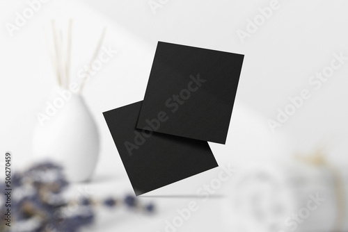 Clean minimal square flyer mockup on top with leaves and vase