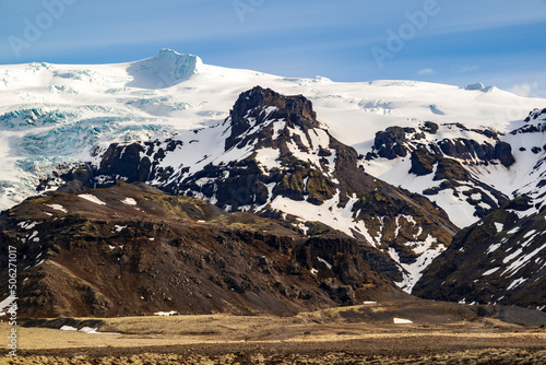 Distant view of Rótarfjallshnúkur (1828 m), one of the many peaks of Öræfajökull, from Háalda parking lot next to Route 1 / Ring Road, Vatnajökull National Park, Iceland photo