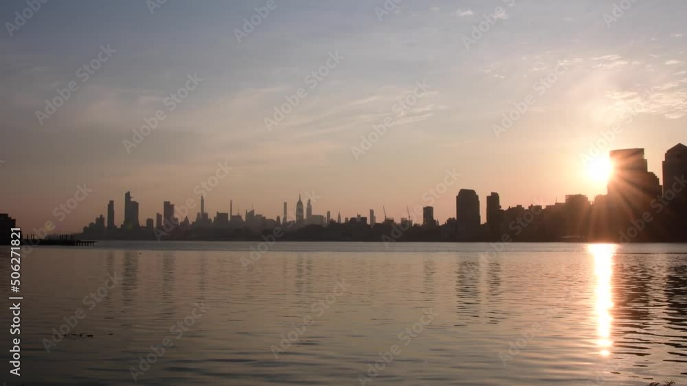 Silhouette skyline of NYC taken from Liberty State Park during morning sunrise, city park, travel tourism theme, NJ park Silhouette skyline of NYC taken from Liberty State Park during morning sunrise, city park, travel tourism theme, NJ park