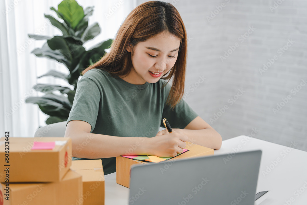 Small start-up business owners checking parcels at work, freelancers, salespeople, checking production orders. Pack products for delivery to customers Sell ​​Ecommerce Shipping Ideas