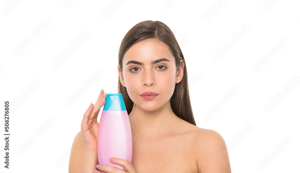 presenting female cosmetic product. woman with bare shoulders use shampoo. presenting female cosmetic product. woman with bare shoulders use shampoo.