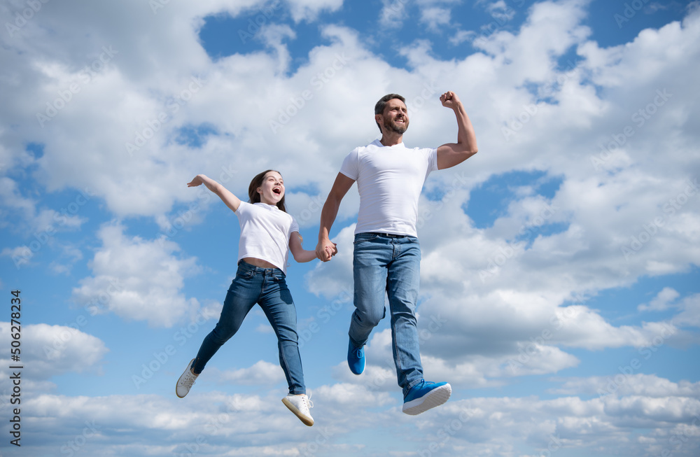 happy father and daughter jump in sky. freedom happy father and daughter jump in sky. freedom