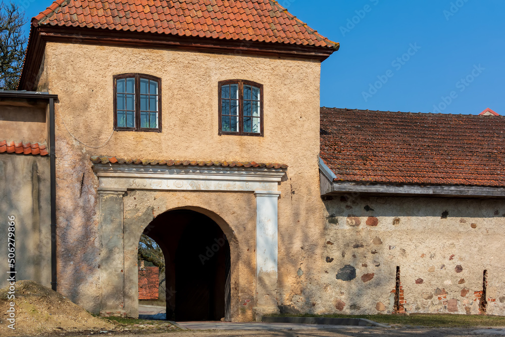 Arch passway in The Slokenbeka manor yard in Milzkalne, Latvia. The manor is a national archaeological and architectural site. It is the only fortified manor in Latvia remained.