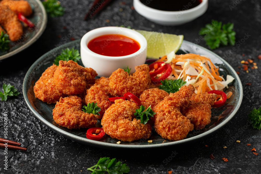 Crispy Prawns in breadcrumbs. Served with cabbage, carrot salad and soy and sweet chilli sauce Crispy Prawns in breadcrumbs. Served with cabbage, carrot salad and soy and sweet chilli sauce