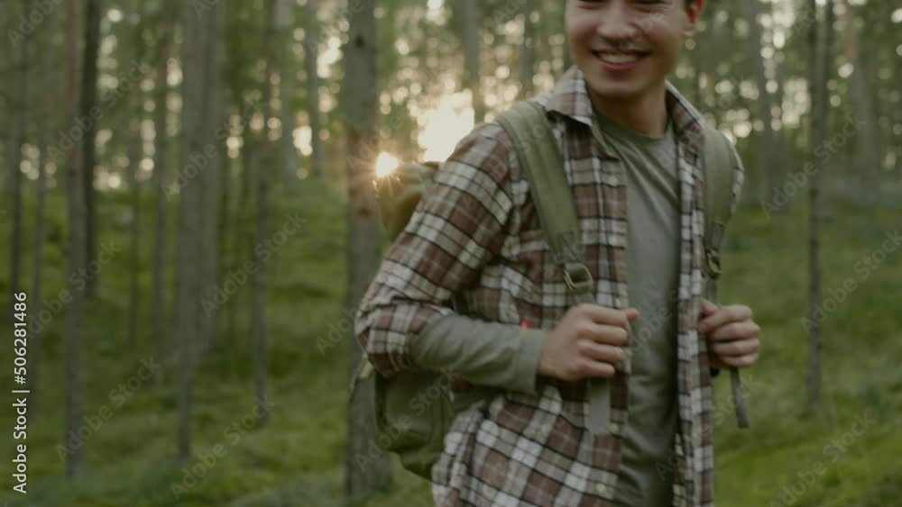 Group of people hiking in a forest Group of people hiking in a forest