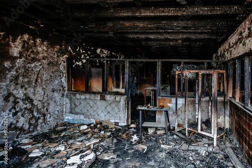 Burned interiors of hospital. Fire or war consequences concept