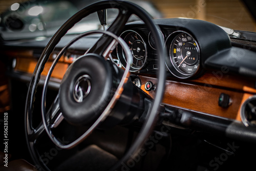 Classic, vintage dash with visible instrument cluster of a luxury motor from late 60s