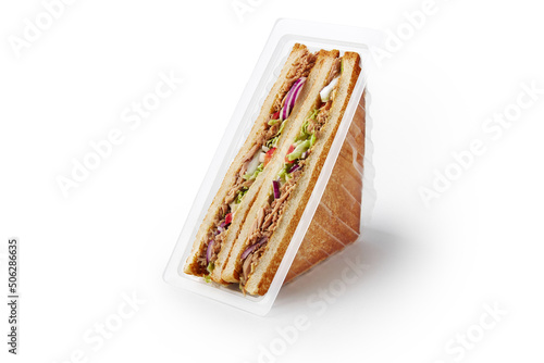 Pair of fresh tuna sandwiches in food container on white