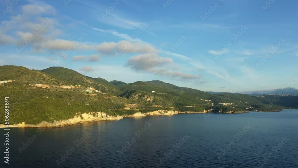The sheer cliffs of the Greek countryside by the Ionian Sea in Europe, Greece, Epirus in summer on a sunny day. The sheer cliffs of the Greek countryside by the Ionian Sea in Europe, Greece, Epirus in summer on a sunny day.