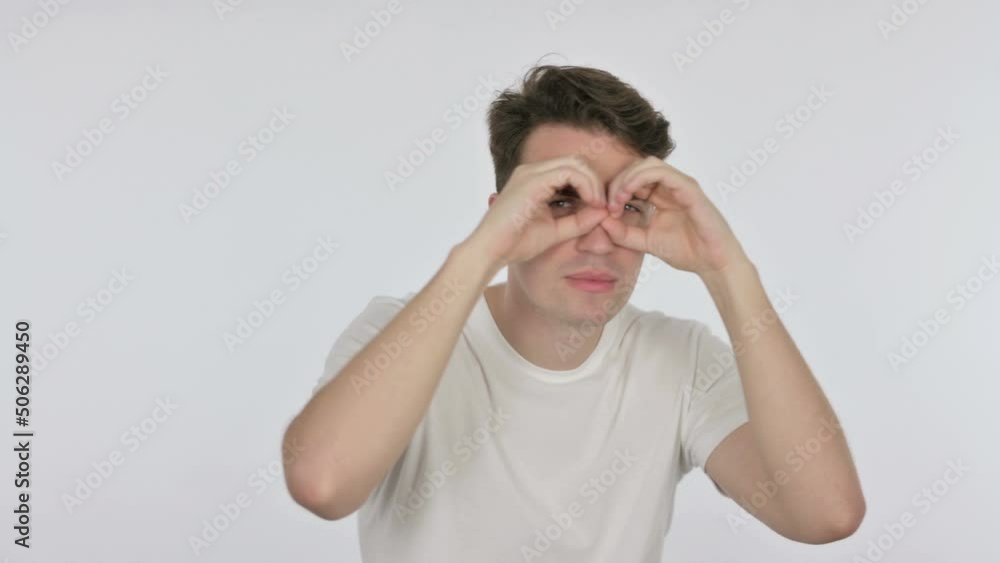 Searching Young Man with Binocular Gesture on White Background Searching Young Man with Binocular Gesture on White Background