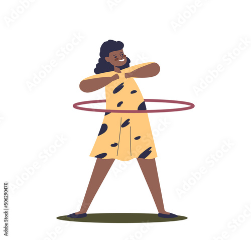 Happy african american girl spinning hula hoop on waist. Funny kid enjoy sport recreation activity