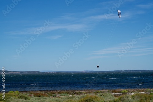Flying kytesurfer in the air