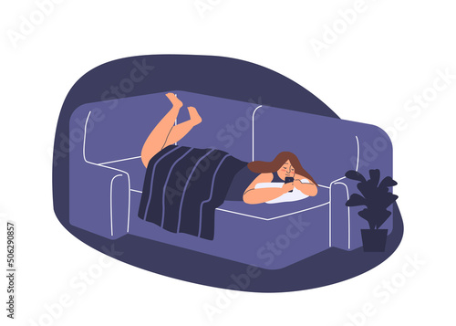 Young girl spend time lying in bed with smartphone. Woman chat in social media messenger in bedroom