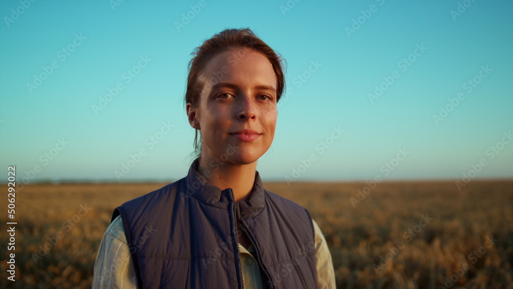 Portrait smiling farmer posing at grain field. Beautiful rural landscape view. Portrait smiling farmer posing at grain field. Beautiful rural landscape view.