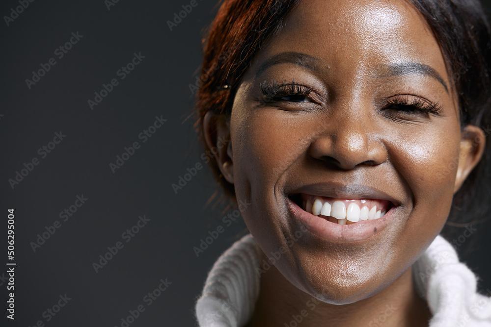 Happy joyful african american woman toothy smiling. Black female laughing. Candid positive emotions. Close up portrait Happy joyful african american woman toothy smiling. Black female laughing. Candid positive emotions. Close up portrait