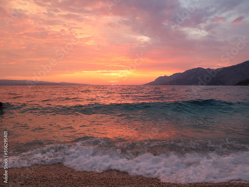 Sunset on the sea, red-orange sky and stormy sea on a summer evening, Croatia, Dalmatia