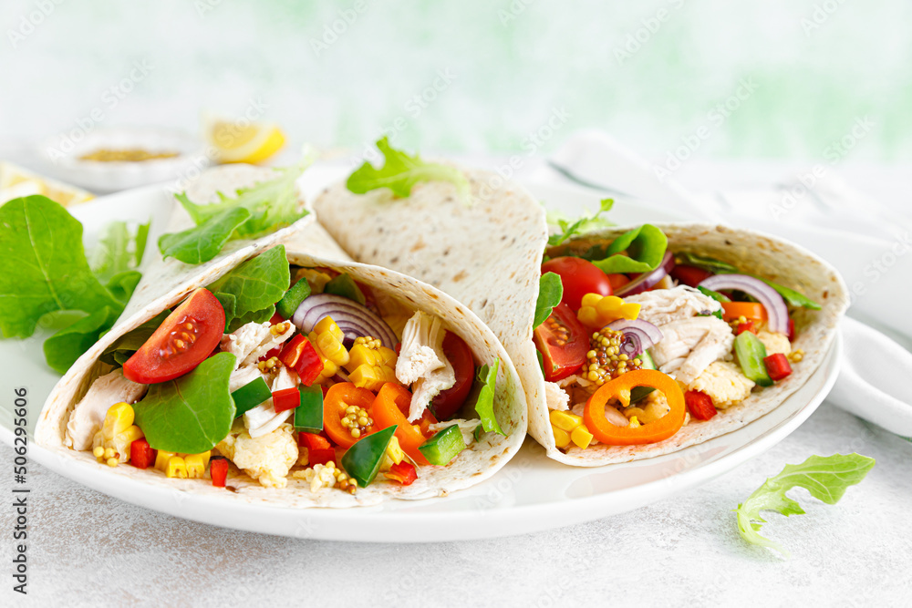 Mexican tacos with chicken meat and vegetables Mexican tacos with chicken meat and vegetables