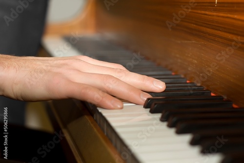 playing hands on Piano Keyboard hands on photo