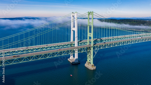 Aerial view of the Narrows bridge in Tacoma Washington with clouds drifting in
 photo