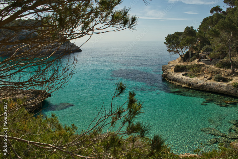 Panoramic view of Cala Mitjana on a sunny day from the Cami de Cavalls route on the island of Menorca, Balearic Islands, Spain.