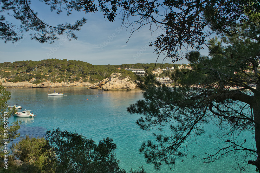 Panoramic view of Cala Galdana on a sunny day from the Cami de Cavalls route on the island of Menorca, Balearic Islands, Spain.