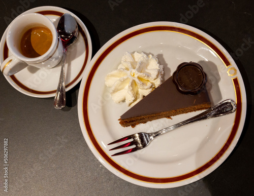 Photography Piece of famous Sachertorte chocolate cake with apricot jam of Austrian origin s