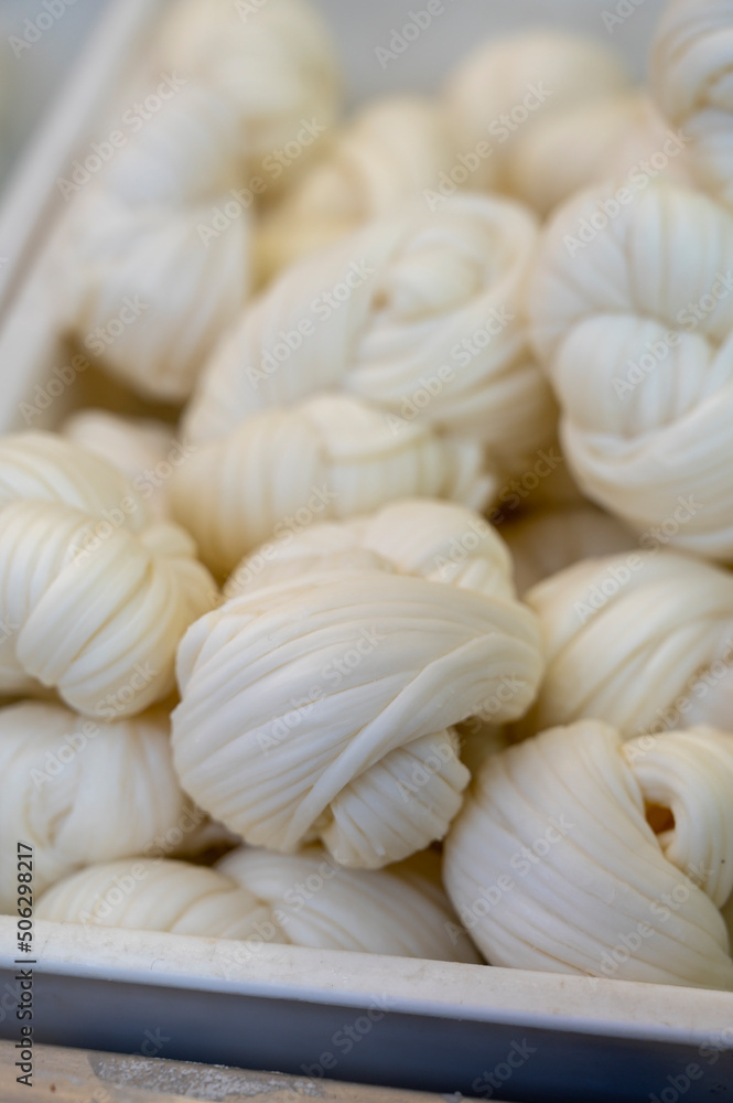 White soft braid cheese on market display White soft braid cheese on market display
