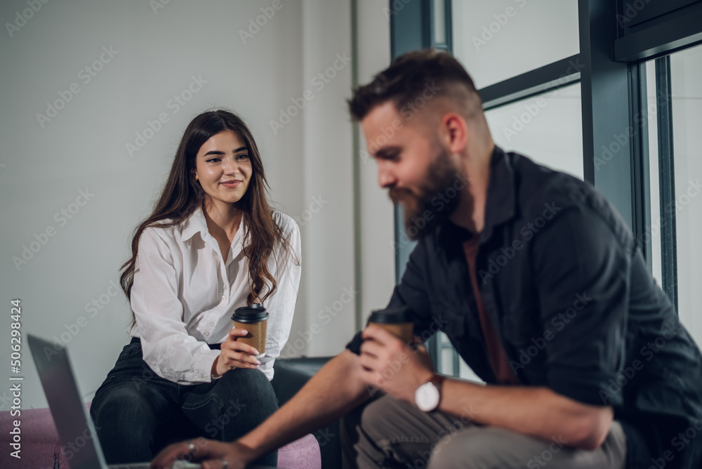 Two business colleagues having a meeting in the open space office Two business colleagues having a meeting in the open space office