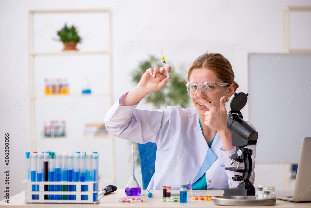 Young female chemist in drugs synthesis concept Young female chemist in drugs synthesis concept