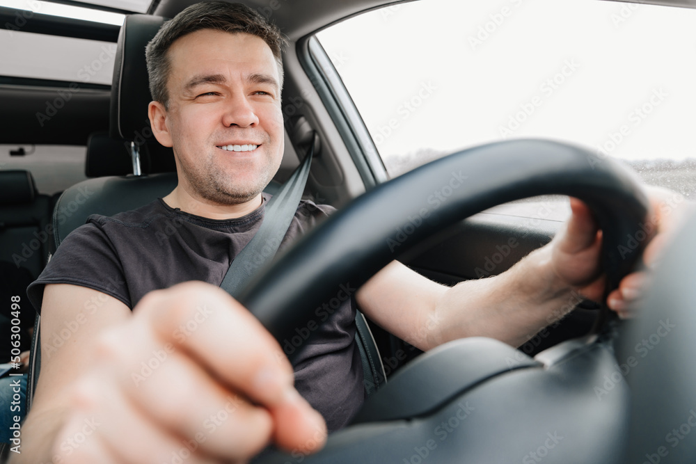 a happy man drives a car on the highway a happy man drives a car on the highway