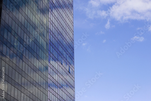modern glass office buildings with blue sky background