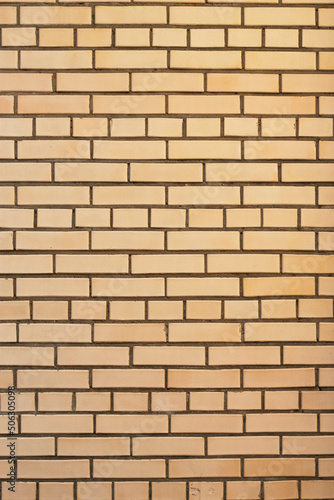 vertical modern yellow brick wall as a textured background