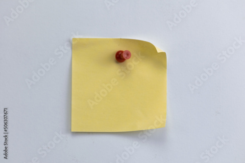 Sheet of paper pinned to white blank