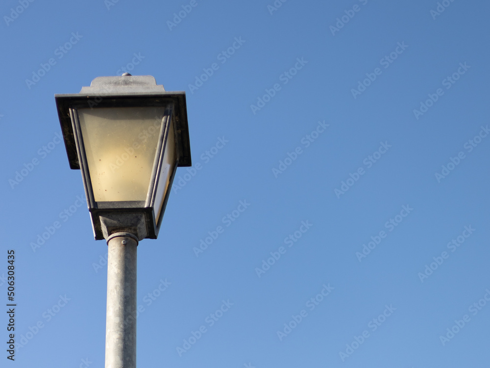 single streetlight during the day with blue sky background single streetlight during the day with blue sky background